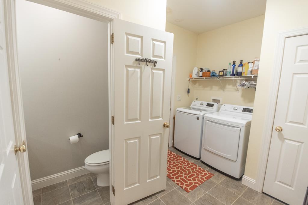 Laundry area and Powder Rm. off Kitchen